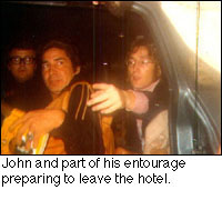 John and his entourage preparing to leave the hotel.